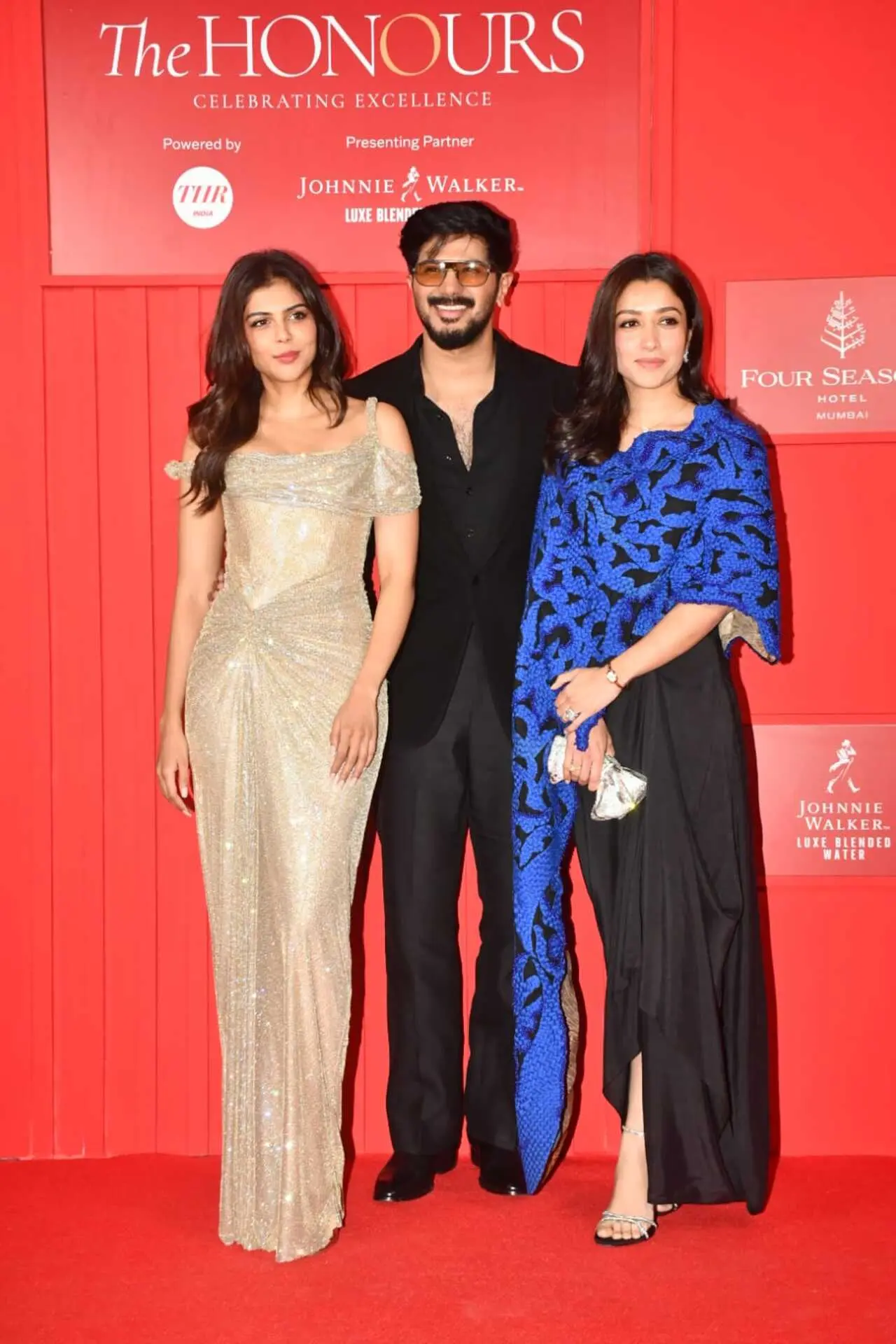 Dulquer Salmaan was seen at the red carpet of an event in the city, accompanied by Lokah star Kalyani Priyadarshan and his wife Amal Sufiya.